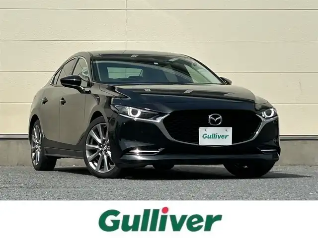 マツダ マツダ３セダン X Lパッケージ 茨城県 2020(令2)年 5.5万km ジェットブラックマイカ メーカーＯＰナビ/　（AM/FM/BT/CD/DVD)/HDMI/フルセグテレビ/バックカメラ/ビルトインETC/プッシュスタート/シートヒーター/ハンドルヒーター/パワーシート/レーダークルーズコントロール/BOSEサウンド/革シート/純正フロアマット/パワーバックドア