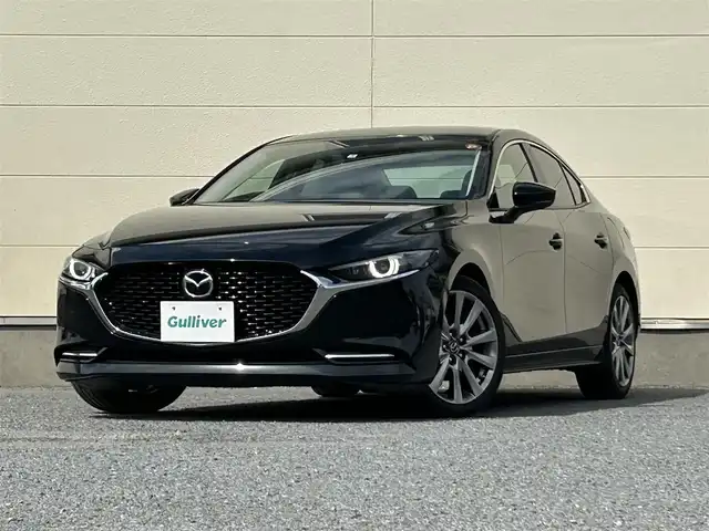 マツダ マツダ３セダン X Lパッケージ 茨城県 2020(令2)年 5.5万km ジェットブラックマイカ メーカーＯＰナビ/　（AM/FM/BT/CD/DVD)/HDMI/フルセグテレビ/バックカメラ/ビルトインETC/プッシュスタート/シートヒーター/ハンドルヒーター/パワーシート/レーダークルーズコントロール/BOSEサウンド/革シート/純正フロアマット/パワーバックドア