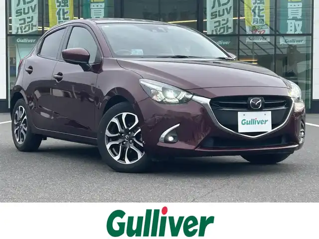 マツダ デミオ XD ツーリング 岡山県 2017(平29)年 5.1万km ディープクリムゾンマイカ 登録時走行距離50652km/純正ナビ/(AM/FM/DISC/TV/Bluetooth)/i-ACTIVSENSE/・スマート・シティ・ブレーキ・サポート（SCBS）/・AT誤発進抑制制御/・ダイナミック・スタビリティ・コントロールシステム（DSC）/・トラクション・コントロール・システム（TCS）/マツダ・レーダー・クルーズ・コントロール（ＭＲＣＣ）/バックカメラ/シートヒーター(D+N席)/ヘッドアップディスプレイ/ETC2.0/パドルシフト/スペアキー×1/コーナーセンサー/ドライブレコーダー/純正16インチAW/プッシュスタート/スマートキー