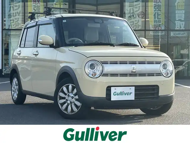 スズキ ラパン X 岡山県 2020(令2)年 8.4万km シフォンアイボリーM 登録時走行距離83532km/社外ナビ/（AM/FM/CD/DVD/BT）/衝突軽減ブレーキ/アイドリングストップ/レーンキープアシスト/D席シートヒーター/横滑り防止装置/オートライト/オートエアコン/ETC/プッシュスタート/スマートキー/純正14インチアルミホイール