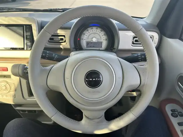 スズキ ラパン X 岡山県 2020(令2)年 8.4万km シフォンアイボリーM 登録時走行距離83532km/社外ナビ/（AM/FM/CD/DVD/BT）/衝突軽減ブレーキ/アイドリングストップ/レーンキープアシスト/D席シートヒーター/横滑り防止装置/オートライト/オートエアコン/ETC/プッシュスタート/スマートキー/純正14インチアルミホイール