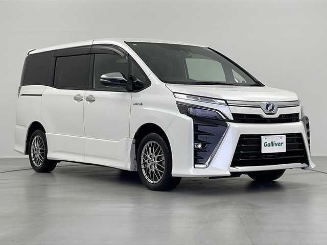 トヨタ ヴォクシー ハイブリッド ZS 煌Ⅱ 岐阜県 2019(令1)年 4.3万km ホワイトパールクリスタルシャイン トヨタセーフティセンス/・プリクラッシュブレーキ/・レーンディパーチャーアラート（LDA）/・クルーズコントロール/・オートマチックハイビーム（AHB）/クリアランスソナー/純正ナビ/Bluetooth/フルセグTV/CD/DVD/バックカメラ/両側パワースライドドア/ドライブレコーダー前後/シートヒーター（運転席/助手席）/スマートキー/プッシュスタート/革ステアリング/ステアリングスイッチ/LEDヘッドライト/フォグランプ/純正アルミホイール/純正ドアバイザー/社外フロアマット/ETC2.0