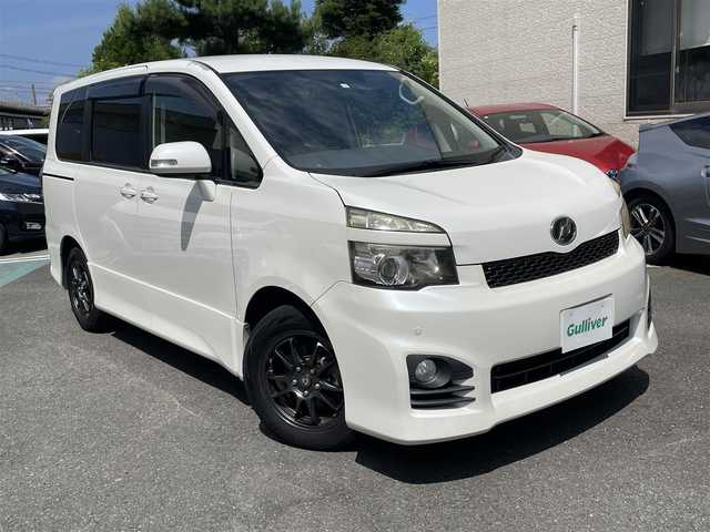 トヨタ ヴォクシー ZS 静岡県 2010(平22)年 7.6万km ホワイトパールクリスタルシャイン 純正ナビ/フルセグTV/DVD/CD/BT/MSV/バックカメラ/両側パワースライドドア/社外16インチAW/パドルシフト/ビルトインETC/HIDヘッドライト/前方ドライブレコーダー/保証書/取扱説明書/H25/27/29/R1/3/5点検記録簿有
