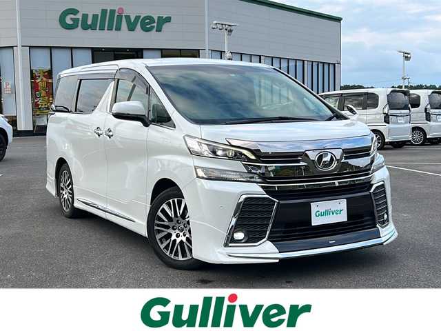 トヨタ ヴェルファイア Z Gエディション 佐賀県 2016(平28)年 14.6万km ホワイトパールクリスタルシャイン ・モデリスタエアロ/・純正9インチナビ/（フルセグ/Bluetooth/DISC/SD/SDREC/AM/FM）/・バックカメラ/・フリップダウンモニター/・ドライブレコーダー/・横滑り防止装置/・LEDヘッドライト/・フォグランプ/・ETC/・両側パワースライドドア/・D/N席パワーシート/・ヒートステアリング/・イルミネーションランプ