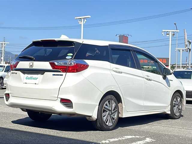 ホンダ シャトル ハイブリッド ホンダセンシング 徳島県 2018(平30)年 5.4万km ホワイトオーキッドパール 禁煙車/純正ナビ/（Bluetooth/CD/SD）/HIDヘッドライト/オートエアコン/社外フロアマット/ETC/純正ホイールキャップ/パワステ/パワーウィンドウ/Wエアバッグ/横滑り防止/盗難防止装置
