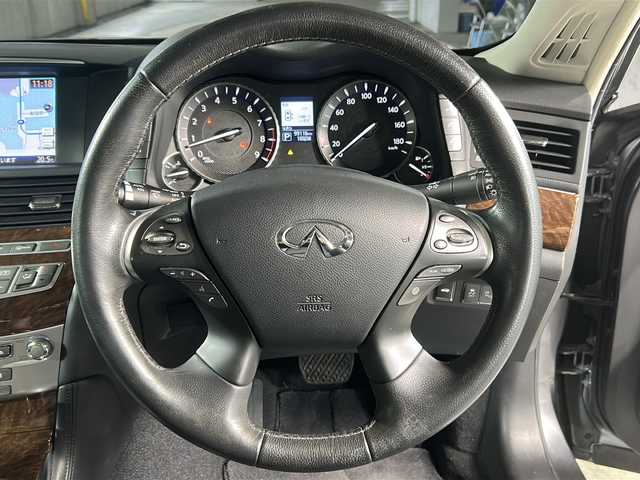 日産 フーガ 370GT 広島県 2015(平27)年 9.9万km ダークメタルグレー 衝突被害軽減ブレーキ/レーンキープアシスト/後側方衝突防止支援システム/ハーフレザーシート/パワーシート/純正HDDナビ/　(AM/FM/CD/DVD/TV/HDD/Bluetooth)/フルセグTV/バックカメラ/レーダークルーズコントロール/ステアリングスイッチ/革巻きステアリング/LEDライト/オートライト/スマートキー/スペアキー/プッシュスタート/社外アルミホイール20インチ/電格ミラー/純正フロアマット/車高調