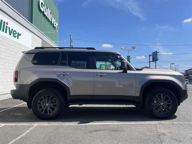 トヨタ ランドクルーザー ２５０ VX 神奈川県 2024(令6)年 0.2万km アバンギャルドブロンズメタリック ワンオーナー/12.3インチディスプレイオーディオ/　・パノラミックビューモニター/　・フルセグTV/BT/AppleCarPlay/AndroidAuto/Toyota Safety Sense/　・プリクラッシュセーフティ/　・LTA＋LDA/　・レーダークルーズコントロール/　・オートマチックハイビーム/　・ロードサインアシスト/　・ドライバー異常時対応システム/　・プロアクティブドライビングシステム/　・発進遅れ告知機能/サンルーフ/前席/　・シートヒーター/　・シートベンチレーション/純正18インチAW/前後ドラレコ/HDMI入力端子/ルーフレール/スマートキー×2/取扱説明書/整備記録簿