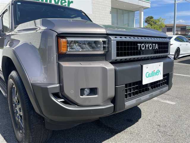 トヨタ ランドクルーザー ２５０ VX 神奈川県 2024(令6)年 0.2万km アバンギャルドブロンズメタリック ワンオーナー/12.3インチディスプレイオーディオ/　・パノラミックビューモニター/　・フルセグTV/BT/AppleCarPlay/AndroidAuto/Toyota Safety Sense/　・プリクラッシュセーフティ/　・LTA＋LDA/　・レーダークルーズコントロール/　・オートマチックハイビーム/　・ロードサインアシスト/　・ドライバー異常時対応システム/　・プロアクティブドライビングシステム/　・発進遅れ告知機能/サンルーフ/前席/　・シートヒーター/　・シートベンチレーション/純正18インチAW/前後ドラレコ/HDMI入力端子/ルーフレール/スマートキー×2/取扱説明書/整備記録簿