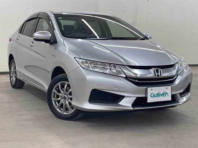 ホンダ グレイス ハイブリッド LX 道央・札幌 2015(平27)年 16万km アラバスターシルバーメタリック 4WD/社外SDナビ/DVD・CD・BT/フルセグTV/クルーズコントロール/車外カメラ（バック・フロント）/ETC/クリアランスソナー/シートヒーター/ECONモード/純正フロアマット/スマートキー/スペアキー（2本）/保証書