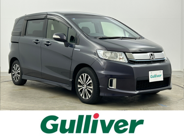 ホンダ フリード スパイク ハイブリット ジャストセレクション 岡山県 2015(平27)年 7.2万km グラマラスモーブP 純正ナビ/VXM-152VFi/(CD/DVD/TV/BT)/バックカメラ/両側パワースライドドア/HIDヘッドライト/オートライト/ビルトインETC/純正15インチアルミ/クルーズコントロール/社外フロアマット/ドアバイザー/スマートキー×1