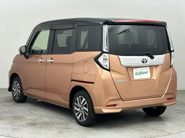 トヨタ ルーミー カスタムG 道央・札幌 2021(令3)年 1.8万km ブラックマイカメタリック/ブリリアントカッパークリスタルマイカ 2トーン ・４WD/・寒冷地仕様/・ディーラーオプション９インチSDナビ/・CD/DVD/BT/SD/フルセグTV/・バックカメラ/・ステアリングスイッチ/・ビルトインETC/・スマートアシスト/・プリクラッシュセーフティ/・レーンキープアシスト/・レーダークルーズコントロール/・アイドリングストップ/・電動パーキングブレーキ/・ブレーキホールド/・両側パワースライドドア/・D席＋N席ヒートヒーター/・２列目サンシェード/・シートバックテーブル/・オートマチックハイビーム/・オートライト/・LEDヘッドライト/・LEDフォグランプ/・LEDデイライト/・ドアミラーウィンカー/・オートリトラクタブルドアミラー/・ドアバイザー/・純正フロアマット/・プッシュスタート/・スマートキー/・純正１４インチAW（夏）
