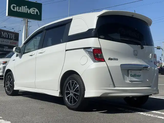 ホンダ フリード スパイク ハイブリット ジャストセレクション 徳島県 2014(平26)年 9.5万km ホワイトオーキッドパール 社外SDナビ　VXM-152VFi/　AM/FM/BT/SD/DISC/Music Rac/フルセグ/ドライブレコーダー/後席用モニター　VM-155EN/ビルトインETC/両側電動スライドドア/バックカメラ/クルーズコントロール/社外15インチアルミホイール　SPORT KRONE/ドアバイザー/純正フロアマット/オートライト/スマートキー/スペアキー/E CON/新車時保証書/新車時取扱説明書