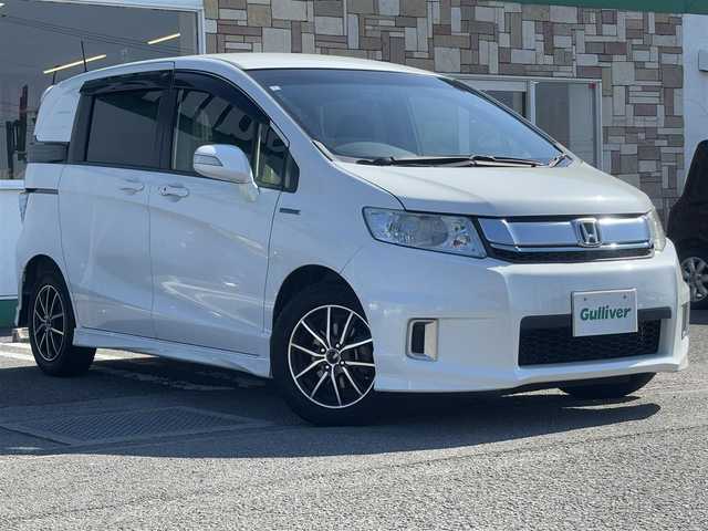 ホンダ フリード スパイク ハイブリット ジャストセレクション 徳島県 2014(平26)年 9.5万km ホワイトオーキッドパール 社外SDナビ　VXM-152VFi/　AM/FM/BT/SD/DISC/Music Rac/フルセグ/ドライブレコーダー/後席用モニター　VM-155EN/ビルトインETC/両側電動スライドドア/バックカメラ/クルーズコントロール/社外15インチアルミホイール　SPORT KRONE/ドアバイザー/純正フロアマット/オートライト/スマートキー/スペアキー/E CON/新車時保証書/新車時取扱説明書
