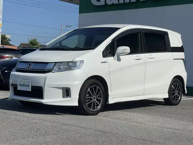ホンダ フリード スパイク ハイブリット ジャストセレクション 徳島県 2014(平26)年 9.5万km ホワイトオーキッドパール 社外SDナビ　VXM-152VFi/　AM/FM/BT/SD/DISC/Music Rac/フルセグ/ドライブレコーダー/後席用モニター　VM-155EN/ビルトインETC/両側電動スライドドア/バックカメラ/クルーズコントロール/社外15インチアルミホイール　SPORT KRONE/ドアバイザー/純正フロアマット/オートライト/スマートキー/スペアキー/E CON/新車時保証書/新車時取扱説明書