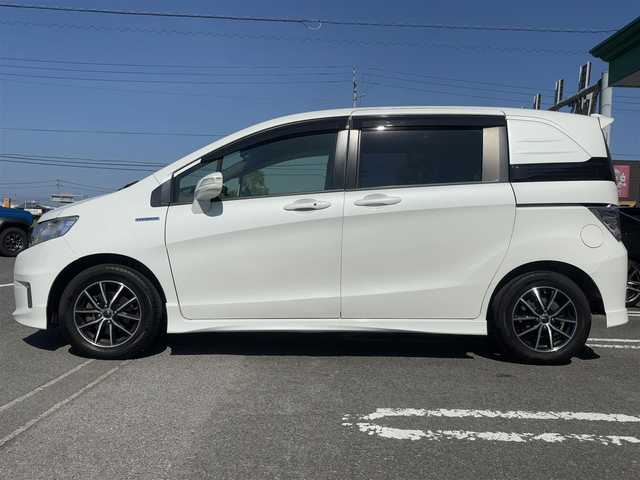 ホンダ フリード スパイク ハイブリット ジャストセレクション 徳島県 2014(平26)年 9.5万km ホワイトオーキッドパール 社外SDナビ　VXM-152VFi/　AM/FM/BT/SD/DISC/Music Rac/フルセグ/ドライブレコーダー/後席用モニター　VM-155EN/ビルトインETC/両側電動スライドドア/バックカメラ/クルーズコントロール/社外15インチアルミホイール　SPORT KRONE/ドアバイザー/純正フロアマット/オートライト/スマートキー/スペアキー/E CON/新車時保証書/新車時取扱説明書
