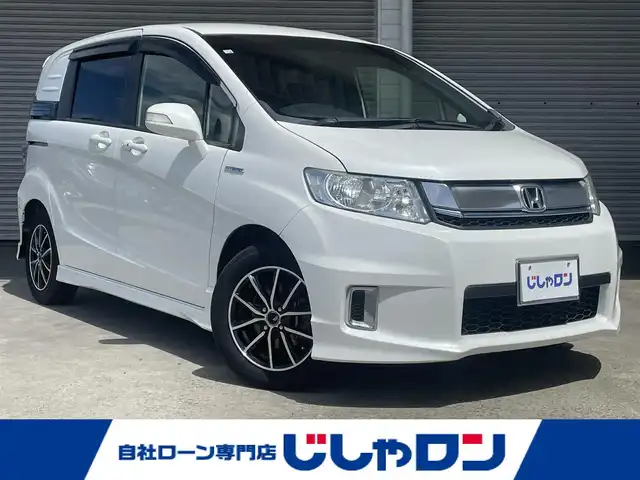 ホンダ フリード スパイク ハイブリット ジャストセレクション 茨城県 2014(平26)年 9.5万km ホワイトオーキッドパール (株)IDOMが運営する【じしゃロン水戸店】の自社ローン専用車両になりますこちらは現金またはオートローンご利用時の価格です。自社ローンご希望の方は別途その旨お申付け下さい/純正ナビ/-CD DVD BT フルセグTV-/フリップダウンモニター/両側パワスラ/スペアキー/バックカメラ