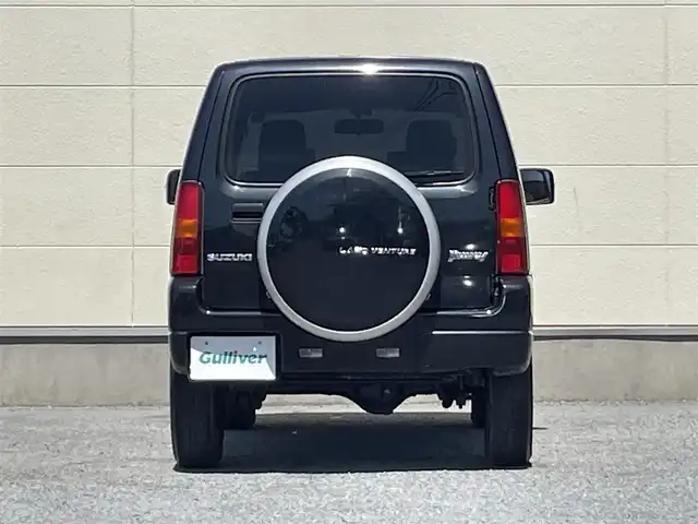 スズキ ジムニー ランドベンチャー 茨城県 2014(平26)年 9.5万km ブルーイッシュブラックパール3 ４WD/背面タイヤ/AW純正/社外ナビ/ワンセグテレビ/ハロゲンヘッドライト/リモコンキー/スペアキー/シートヒーター/ミラーヒーター/ハーフレザーシート/パワステ/パワーウィンドウ/ABS/ETC