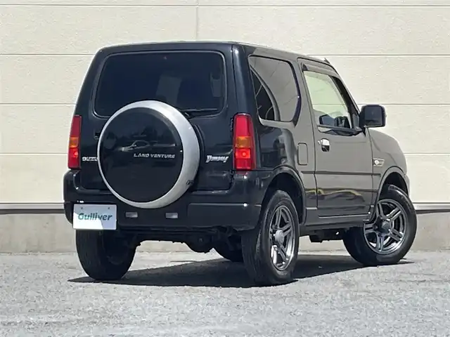 スズキ ジムニー ランドベンチャー 茨城県 2014(平26)年 9.5万km ブルーイッシュブラックパール3 ４WD/背面タイヤ/AW純正/社外ナビ/ワンセグテレビ/ハロゲンヘッドライト/リモコンキー/スペアキー/シートヒーター/ミラーヒーター/ハーフレザーシート/パワステ/パワーウィンドウ/ABS/ETC