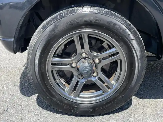 スズキ ジムニー ランドベンチャー 茨城県 2014(平26)年 9.5万km ブルーイッシュブラックパール3 ４WD/背面タイヤ/AW純正/社外ナビ/ワンセグテレビ/ハロゲンヘッドライト/リモコンキー/スペアキー/シートヒーター/ミラーヒーター/ハーフレザーシート/パワステ/パワーウィンドウ/ABS/ETC