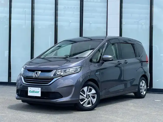 ホンダ フリード ハイブリット G ホンダセンシング 大阪府 2018(平30)年 6.8万km モダンスティールM ホンダセンシング/・衝突軽減ブレーキ/・両側パワースライドドア/・レーダークルーズコントロール/・レーンキープアシスト/純正９インチナビ/　フルセグTV/CD/DVD/Bluetooth/バックモニター/アイドリングストップ/前方ドライブレコーダー/純正15インチアルミホイール/純正フロアマット/プッシュスタート/スマートキー/ビルトインＥＴＣ/ＬＥＤ/禁煙車