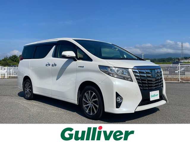 トヨタ アルファードハイブリット G Fパッケージ 富山県 2015(平27)年 11.7万km ホワイトパールクリスタルシャイン 4WD/純正フリップダウンモニター/JBLプレミアムサウンドシステム/純正メーカーナビ/フルセグ/ETC/ドライブレコーダー/トヨタセーフティセンス/衝突被害軽減ブレーキ/レーンキープアシスト/レーダークルーズコントロール/パノラミックビューモニター/パワーバックドア/クリアランスソナー/オートマチックハイビーム/本革シート/シートヒーター/ステアリングヒーター/AC100V/1500W