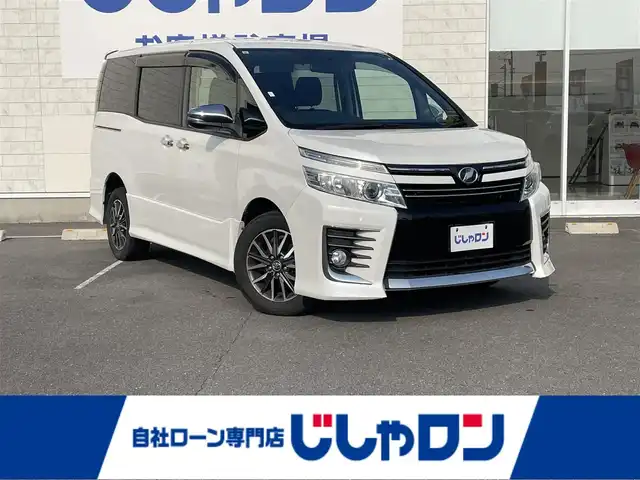 トヨタ ヴォクシー ZS 煌 長崎県 2015(平27)年 14.8万km ホワイトパールクリスタルシャイン (株)IDOMが運営する【じしゃロン長崎店】の自社ローン対象車両になります。こちらは現金ご利用時の価格です。自社ローンご希望の方は別途その旨お申付け下さい。/・プッシュスタート/・純正ナビ/・フルセグテレビ/・ブルートゥース/・バックカメラ/・フリップダウンモニター/・両側パワースライドドア/・ETC/・ドアバイザー