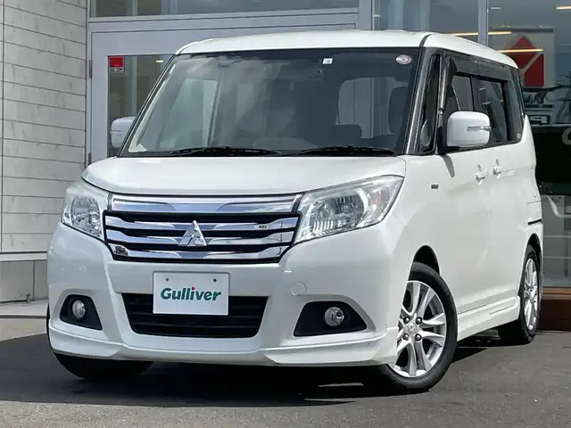 三菱 デリカＤ：２ ハイブリッドMZ 道央・札幌 2018(平30)年 7.1万km ピュアホワイトP ・４WD/・衝突軽減ブレーキ/・ワンオーナー/・社外ナビ/　CD＆BT＆USB＆TV/・レーンキープアシスト/・両側パワースライドドア/・クルーズコントロール/・オートエアコン/・オートライト/・アイドリングストップ/・ミラーヒーター/・シートヒーター/・ドライブレコーダー/・プッシュスタート/・スマートキー/・電動格納ミラー/・純正フロアマット/・ドアバイザー/・ウィンカーミラー/・フォグライト/・HIDヘッドライト/・スペアキー