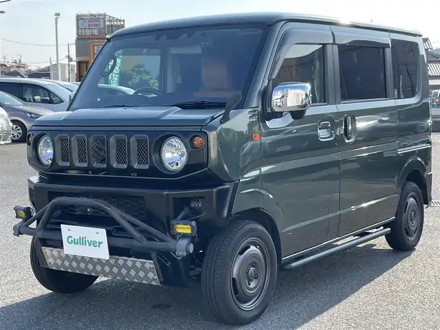 スズキ エブリィ ワゴン PZターボ 広島県 2020(令2)年 3.3万km クールカーキPM ワンオーナー/禁煙車/ジムニーフェイスキット/フロントバンパーガード/社外バンパー/リフトアップ/サイドカバー/社外マフラー/社外ナビ/　【CD/DVD/Bluetooth/フルセグTV】/衝突被害軽減システム/横滑防止装置/盗難防止装置/片側パワースライドドア/D席シートヒーター/レザー調シートカバー/ETC/デジタルインナーミラー/ロットホルダー/純正シリコンカバー/社外ラゲッジトレイ/純正ドアハンドルエスカレッション/フェンダーミラー/オートライト/LEDヘッドライト/社外フォグランプ/プッシュスタート/スマートキー/スペアキー×1/アイドリングストップ/社外アルミホイール 14インチ/ドアバイザー/純正フロアマット/新車時整備手帳（保証書）/取扱説明書