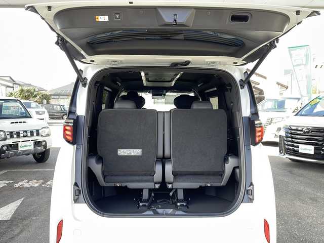 トヨタ アルファードハイブリット Z 愛知県 2025(令7)年 0.1千km プラチナホワイトパールマイカ ワンオーナー/14インチディスプレイオーディオプラス/【コネクティッドナビ対応・フルセグTV・AM/FM・USB入力・HDMI入力・AppleCarPlay・AndrodiAuto】/ETC2.0/左右独立ムーンルーフ/デジタルインナーミラー/パワーシート（前席）/・マイコンプリセットドライビングポジションシステム/助手席肩口パワーシートスイッチ/2列目エグゼクティブパワーシート/【パワーリクライニング・大型ヘッドレスト・快適温熱シート・充電用USB端子・パワーオットマン・折り畳み式サイドテーブル・大型アームレスト】/セーフティセンス（予防安全パッケージ）/【プリクラッシュセーフティ・レーントレーシングアシスト・レーンディパーチャーアラート・全車速追従機能付レーダークルーズコントロール・アダプティブハイビームシステム・ロードサインアシスト】/トヨタチームメイト/カラーヘッドアップディスプレイ/・タッチトレーサーオペレーション/ユニバーサルステップ/グローブボックス照明/おくだけ充電/床下透過表示機能付パノラミックビューモニター/3眼LEDヘッドライトランプ/新車保証書/スペアキー