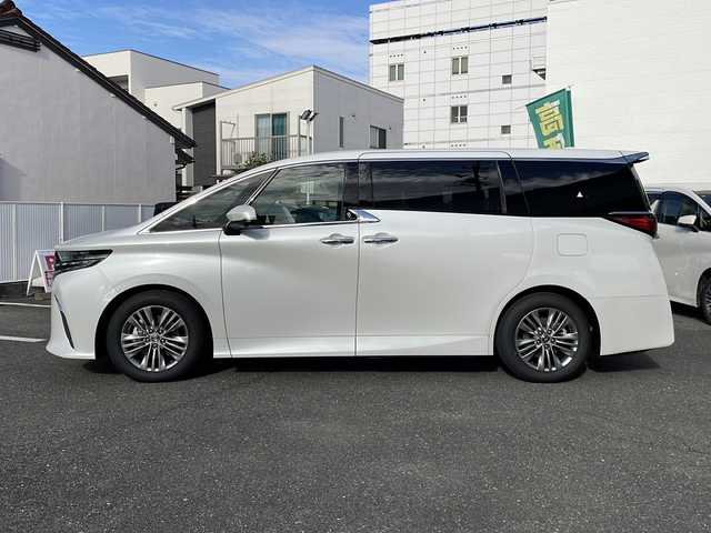 トヨタ アルファードハイブリット Z 愛知県 2025(令7)年 0.1千km プラチナホワイトパールマイカ ワンオーナー/14インチディスプレイオーディオプラス/【コネクティッドナビ対応・フルセグTV・AM/FM・USB入力・HDMI入力・AppleCarPlay・AndrodiAuto】/ETC2.0/左右独立ムーンルーフ/デジタルインナーミラー/パワーシート（前席）/・マイコンプリセットドライビングポジションシステム/助手席肩口パワーシートスイッチ/2列目エグゼクティブパワーシート/【パワーリクライニング・大型ヘッドレスト・快適温熱シート・充電用USB端子・パワーオットマン・折り畳み式サイドテーブル・大型アームレスト】/セーフティセンス（予防安全パッケージ）/【プリクラッシュセーフティ・レーントレーシングアシスト・レーンディパーチャーアラート・全車速追従機能付レーダークルーズコントロール・アダプティブハイビームシステム・ロードサインアシスト】/トヨタチームメイト/カラーヘッドアップディスプレイ/・タッチトレーサーオペレーション/ユニバーサルステップ/グローブボックス照明/おくだけ充電/床下透過表示機能付パノラミックビューモニター/3眼LEDヘッドライトランプ/新車保証書/スペアキー