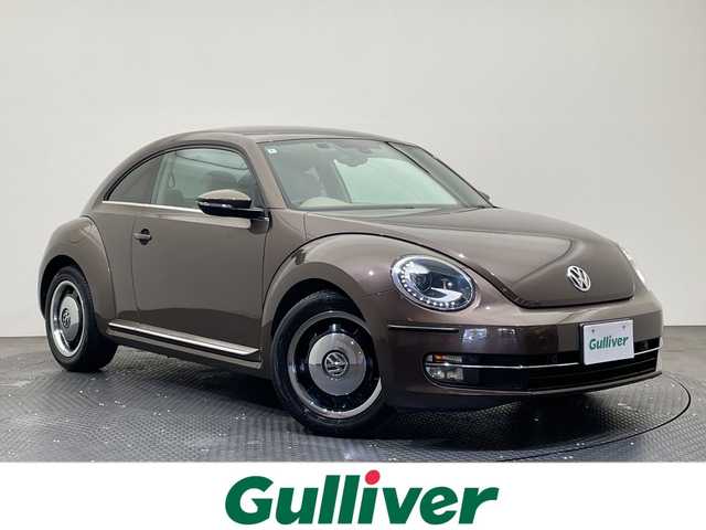 フォルクスワーゲン ザ・ビートル チョコ 愛媛県 2014(平26)年 8万km 茶 社外７インチナビ/Bluetooth/ワンセグテレビ/ドライブレコーダー/ETC/プッシュスタート/LEDヘッドライト/オートライト/フォグランプ/電動格納ミラー