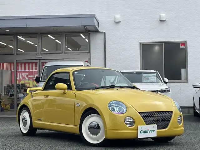 ダイハツ コペン ULTIMATE Ⅱ メモリアル 熊本県 2007(平19)年 10.8万km ジョーヌイエロー ディスプレイオーディオ/【Bluetooth再生】/MOMOステアリング/リアスポイラー/社外マフラー（BE FREE）/バックカメラ/レザーシート/運転席・助手席シートヒーター/社外15インチアルミホイール/HIDライト/ETC/HKSエアーインテーク/電動オープン動作確認済み