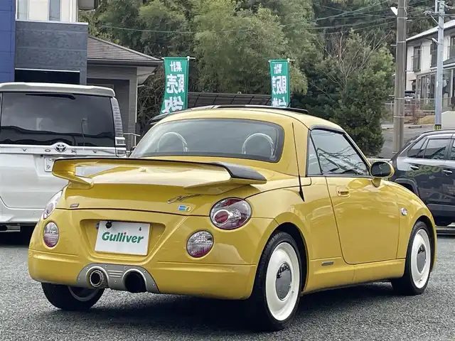 ダイハツ コペン ULTIMATE Ⅱ メモリアル 熊本県 2007(平19)年 10.8万km ジョーヌイエロー ディスプレイオーディオ/【Bluetooth再生】/MOMOステアリング/リアスポイラー/社外マフラー（BE FREE）/バックカメラ/レザーシート/運転席・助手席シートヒーター/社外15インチアルミホイール/HIDライト/ETC/HKSエアーインテーク/電動オープン動作確認済み