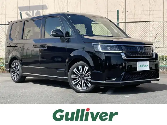 ホンダ ステップワゴン スパーダ プレミアムライン 東京都 2024(令6)年 2万km クリスタルブラックパール ワンオーナー/ホンダコネクト11型ナビ＆フルセグ/・BluetoothAudio/・AppleCarPlay＆AndroidAuto/・CD/SD/DVD/AM/FM/USB/純正１５型フリップダウンモニター/（VM-231FE）/アラウンドビューモニター/ブラインドスポットモニター/スウェード調コンビシート/・前席シートヒーター/・２列目キャプテンシート/LEDヘッドライト/両側パワースライドドア/パワーバックドア/ホンダセンシング/（安全運転支援システム）/・衝突軽減ブレーキ/・追従機能付クルーズコントロール/・歩行者事故低減ステアリング/・車線維持支援システム/・先行車発進お知らせ機能/・標識認識機能/・オートハイビーム/プッシュエンジンスタート