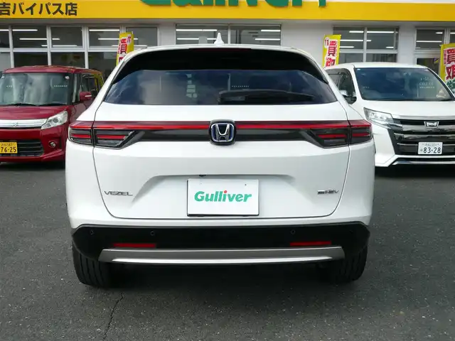ホンダ ヴェゼル ハイブリッド e:HEV Z 静岡県 2024(令6)年 2.2万km プラチナホワイトパール ワンオーナー/禁煙車/Gathersオーディオプレイ/バックカメラ/AppleCarPlay/AndroIdAuto/ホンダセンシング/・衝突被害軽減ブレーキ/・歩行者事故低減ステアリング/・路外逸脱抑制機能/・先行車発進お知らせ/・標識認識機能/・誤発進抑制機能/・後方誤発進抑制機能/・アダプティブクルーズコントロール/・オートハイビーム/・ブラインドスポットモニター/ダウンヒルアシスト/オートライト/LEDヘッドライト/電動パーキング/AUTO HOLD/ステアリングスイッチ/ステアリングヒーター/フロアマット/ドアバイザー/スマートキー/スペアキー/ETC/新車保証書/取扱瀬説明書