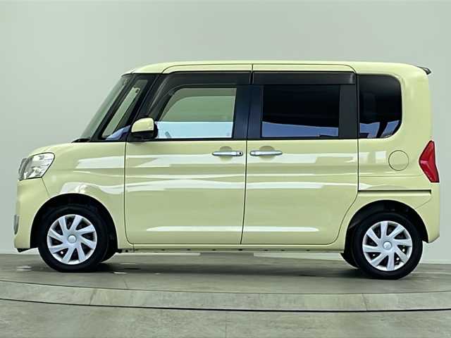 ダイハツ タント X ターボ SA 大阪府 2014(平26)年 5.1万km コットンアイボリー 純正SDナビ/【BT/フルセグ/AUX/DVD」/ETC/バックカメラ/両側パワースライドドア/アイドリングストップ/衝突被害軽減システム/横滑り防止装置/スタッドレスタイヤ積み込み/純正ミッキーマウスシートカバー/純正ミッキーマウスフロアマット/オートライト/サンシェード
