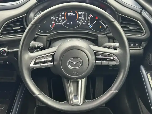 マツダ ＣＸ－３０ 20S プロアクティブツーリングセレ 熊本県 2021(令3)年 2.5万km ジェットブラックマイカ ・禁煙車/・純正8.8インチSDナビ/　Bluetoothオーディオ/　CD/DVD再生/　USB接続/　フルセグテレビ/・アラウンドビューモニター/・ETC/・衝突被害軽減システム/・レーダークルーズコントロール/・レーンキープアシスト/・ドライバーモニタリングシステム/・安全運転支援システム（i-ACTIVSENSE）/・前側方接近車両検知/・後側方接近車両検知/・ブラインドスポットモニター/・前方ドライブレコーダー/・電動リアゲート/・社外フロアマット/・シートヒーター（運転席・助手席）/・メモリーパワーシート（運転席）/・アイドリングストップ/・革巻きステアリング/・ステアリングリモコン/・ステアリングヒーター/・パドルシフト/・電動パーキングブレーキ/・オートブレーキホールド/・純正18インチアルミホイール/・ABS/・横滑り防止機能/・前後コーナーセンサー/・盗難防止装置/・オートライト/・オートマチックハイビーム/・LEDヘッドライト/・W＋サイドエアバック/・オートエアコン/・スマートキー