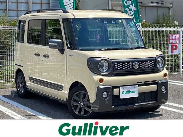 スズキ スペーシア ギア HYBRID XZ 兵庫県 2022(令4)年 0.9万km シフォンアイボリーM 登録時走行距離8766km/ワンオーナー/セーフティサポート/デュアルカメラブレーキサポート/アダプティブクルーズコントロール/純正8型ナビ/CD/DVD/フルセグ/Bluetooth/プッシュスタート/スマートキー/両側パワースライドドア/ガンメタリックドアミラー(電動オート格納機能)/ガンメタリックアウトサイドドアハンドル/ガンメタリックドアガーニッシュ/ガンメタリックサイドシルプロテクター/ガンメタリックバックドアガーニッシュ/ガンメタリックエンブレム/下部ガンメタリックプロテクター付リアバンパー/LEDヘッドランプ/LEDフロントフォグランプ/ヘッドアップディスプレイ/エコクール/リアヒーターダクト/スリムサーキュレーター/前席シートヒーター/後方視界支援ミラー/ETC/ルーフレール/保証書/取説/スペアキー1本