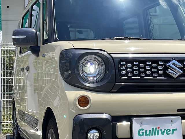 スズキ スペーシア ギア HYBRID XZ 兵庫県 2022(令4)年 0.9万km シフォンアイボリーM 登録時走行距離8766km/ワンオーナー/セーフティサポート/デュアルカメラブレーキサポート/アダプティブクルーズコントロール/純正8型ナビ/CD/DVD/フルセグ/Bluetooth/プッシュスタート/スマートキー/両側パワースライドドア/ガンメタリックドアミラー(電動オート格納機能)/ガンメタリックアウトサイドドアハンドル/ガンメタリックドアガーニッシュ/ガンメタリックサイドシルプロテクター/ガンメタリックバックドアガーニッシュ/ガンメタリックエンブレム/下部ガンメタリックプロテクター付リアバンパー/LEDヘッドランプ/LEDフロントフォグランプ/ヘッドアップディスプレイ/エコクール/リアヒーターダクト/スリムサーキュレーター/前席シートヒーター/後方視界支援ミラー/ETC/ルーフレール/保証書/取説/スペアキー1本