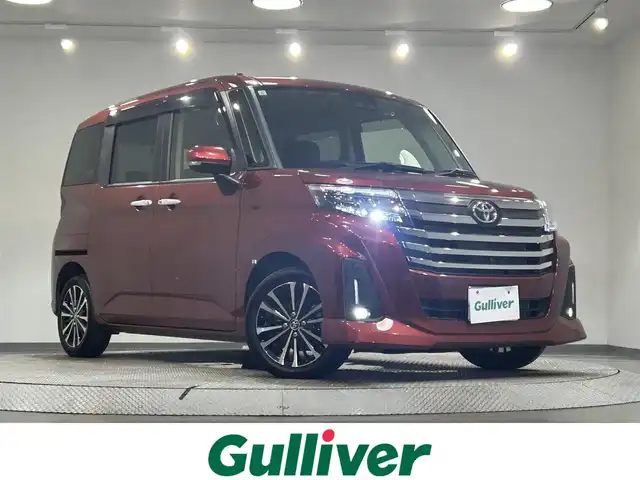 トヨタ ルーミー カスタムG－T 愛知県 2021(令3)年 2.9万km ファイアークォーツレッドM 純正9インチディスプレイオーディオ/（Bluetooth/フルセグTV/Carplay/USB）/スマートアシスト/　　-衝突回避支援ブレーキ/　　-車線逸脱警報/　　-先行車発進お知らせ機能/　　-アダプティブドライビングビーム/　　-コーナーセンサー/　　-標識認識機能/　　-ふらつき警報/　　-レーダークルーズコントロール/両側電動スライドドア/アラウンドビューモニター/LEDヘッドライト/ETC/ドライブレコーダー/スマートキー/アイドリングストップ/電動パーキングブレーキ/純正15インチAW/純正フロアマット/スペアタイヤ有