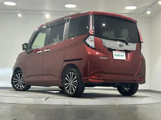 トヨタ ルーミー カスタムG－T 愛知県 2021(令3)年 2.9万km ファイアークォーツレッドM 純正9インチディスプレイオーディオ/（Bluetooth/フルセグTV/Carplay/USB）/スマートアシスト/　　-衝突回避支援ブレーキ/　　-車線逸脱警報/　　-先行車発進お知らせ機能/　　-アダプティブドライビングビーム/　　-コーナーセンサー/　　-標識認識機能/　　-ふらつき警報/　　-レーダークルーズコントロール/両側電動スライドドア/アラウンドビューモニター/LEDヘッドライト/ETC/ドライブレコーダー/スマートキー/アイドリングストップ/電動パーキングブレーキ/純正15インチAW/純正フロアマット/スペアタイヤ有