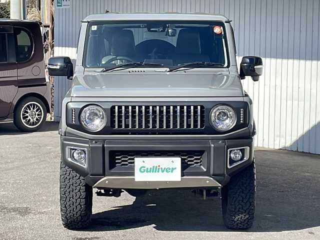 スズキ ジムニー XC 長野県 2020(令2)年 2.1万km ミディアムグレー ４WD/セーフティサポート/純正8型ナビフルセグＴＶ/バックカメラ/クルーズコントロール/プッシュスタート/シートヒーター/オールテレインタイヤ/社外16インチアルミ/社外足回り/社外テールランプ/社外フロントグリル/社外オーバーフェンダー/シートカバー/背面タイヤ/スペアキー