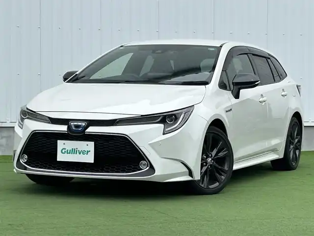トヨタ カローラツーリング ハイブリッド ダブルバイビー 香川県 2020(令2)年 5.4万km ホワイトパールクリスタルシャイン 登録時走行距離：53410km/純正ナビ /フルセグ　/Bカメラ　/クルコン　/ETC　/ドラレコ /革巻きステアリング　/ステアリングリモコン　/純正AW　/純正フロアマット　/レーンキープアシスト　/BSM　/レベライザー/シートヒーター　/スペアキー/プッシュスタート