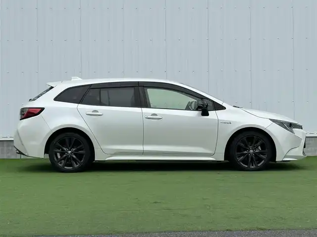 トヨタ カローラツーリング ハイブリッド ダブルバイビー 香川県 2020(令2)年 5.4万km ホワイトパールクリスタルシャイン 登録時走行距離：53410km/純正ナビ /フルセグ　/Bカメラ　/クルコン　/ETC　/ドラレコ /革巻きステアリング　/ステアリングリモコン　/純正AW　/純正フロアマット　/レーンキープアシスト　/BSM　/レベライザー/シートヒーター　/スペアキー/プッシュスタート