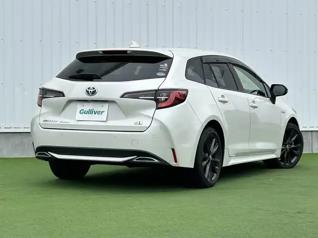 トヨタ カローラツーリング ハイブリッド ダブルバイビー 香川県 2020(令2)年 5.4万km ホワイトパールクリスタルシャイン 登録時走行距離：53410km/純正ナビ /フルセグ　/Bカメラ　/クルコン　/ETC　/ドラレコ /革巻きステアリング　/ステアリングリモコン　/純正AW　/純正フロアマット　/レーンキープアシスト　/BSM　/レベライザー/シートヒーター　/スペアキー/プッシュスタート