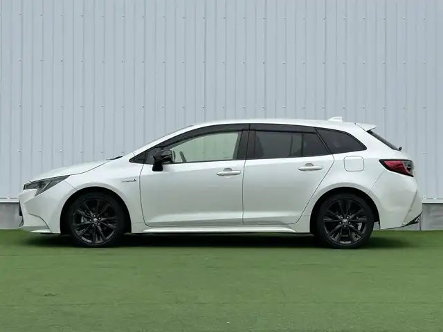 トヨタ カローラツーリング ハイブリッド ダブルバイビー 香川県 2020(令2)年 5.4万km ホワイトパールクリスタルシャイン 登録時走行距離：53410km/純正ナビ /フルセグ　/Bカメラ　/クルコン　/ETC　/ドラレコ /革巻きステアリング　/ステアリングリモコン　/純正AW　/純正フロアマット　/レーンキープアシスト　/BSM　/レベライザー/シートヒーター　/スペアキー/プッシュスタート
