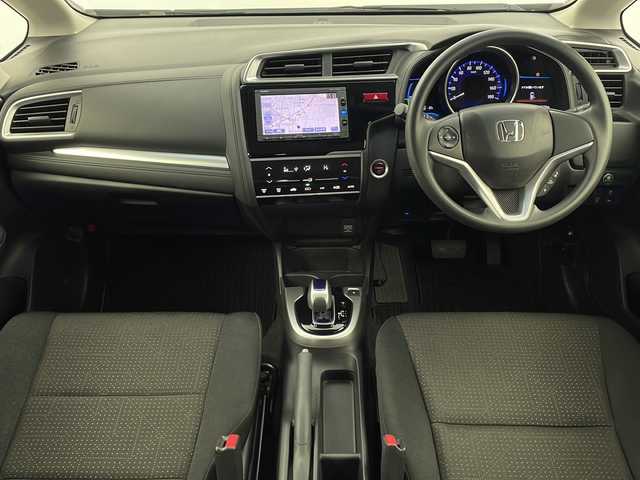 ホンダ フィット ハイブリット Fパッケージ 栃木県 2016(平28)年 3.4万km ブリリアントスポーティブルーメタリック2トーン 福祉車両/助手席回転シート/禁煙車/純正メモリーナビ/・ワンセグ/CD/Bluetooth/SD/USB/バックカメラ/ビルトインETC/前後ドライブレコーダー/オートライト/ステアリングスイッチ/電動格納ウインカーミラー/純正フロアマット/ドアバイザー/●純正ホイールカバー/●保証書/●取扱説明書