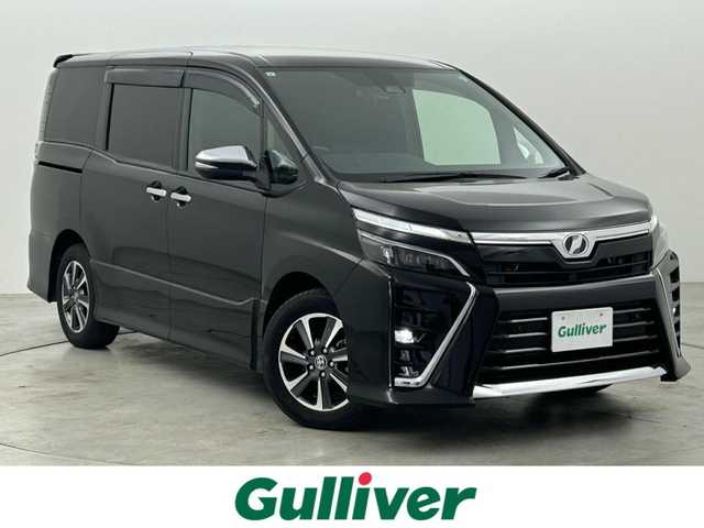 トヨタ ヴォクシー ZS 煌Ⅱ 福岡県 2019(令1)年 5.4万km ブラック 後席モニター　/純正９型ナビ（ＢＴ，フルセグＴＶ）　/バックカメラ/ＥＴＣ　/クルーズコントロール　/コーナーセンサー　/衝突軽減ブレーキ　/レーンキープ　/ＰＫＳＢ　/ＭＴモード付き　/両側電動スライドドア　/ＬＥＤ