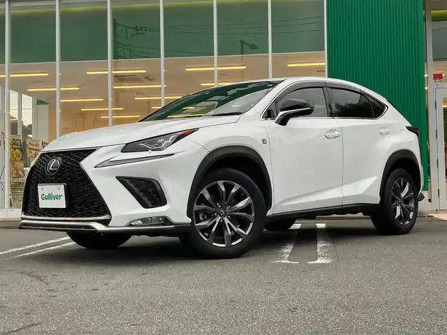レクサス ＮＸ 300 Fスポーツ 静岡県 2018(平30)年 3.9万km ホワイトノーヴァガラスフレーク エンジンスタートボタン/パワーステアリング/パワーウィンドウ/取扱説明書/MTモード付AT/100V充電/アイドリングストップ/AAC/クルーズコントロール（追従走行：有）/USB入力端子/ビルトインETC2.0/全方位カメラ/純正SDナビ（フルセグTV、BT接続、AUX、CDチェンジャー）/電動リアゲート/D+N席パワーシート/D+N席シートヒーター/D+N席エアシート/ステアリングヒーター/社外フロアマット/純正アルミホイール/ABS/横滑り防止装置/レーンキープアシスト/オートライト/オートマチックハイビーム/前後コーナーセンサー/LEDヘッドライト/W+サイドエアバック/カーテンエアバック/衝突軽減システム