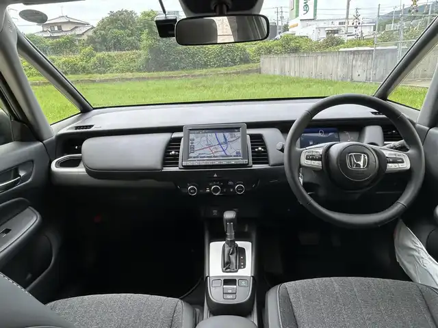 ホンダ フィット e:HEVホーム 長崎県 2023(令5)年 0.1万km プラチナホワイトパール ワンオーナー/純正HDDナビ/(CD/DVD/BT/フルセグ)/バックカメラ/衝突軽減ブレーキ/レーンアシスト/コーナーセンサー/レーダークルーズ/ハーフレザーシート/ETC/オートライト/電子パーキングブレーキ/電動格納ミラー